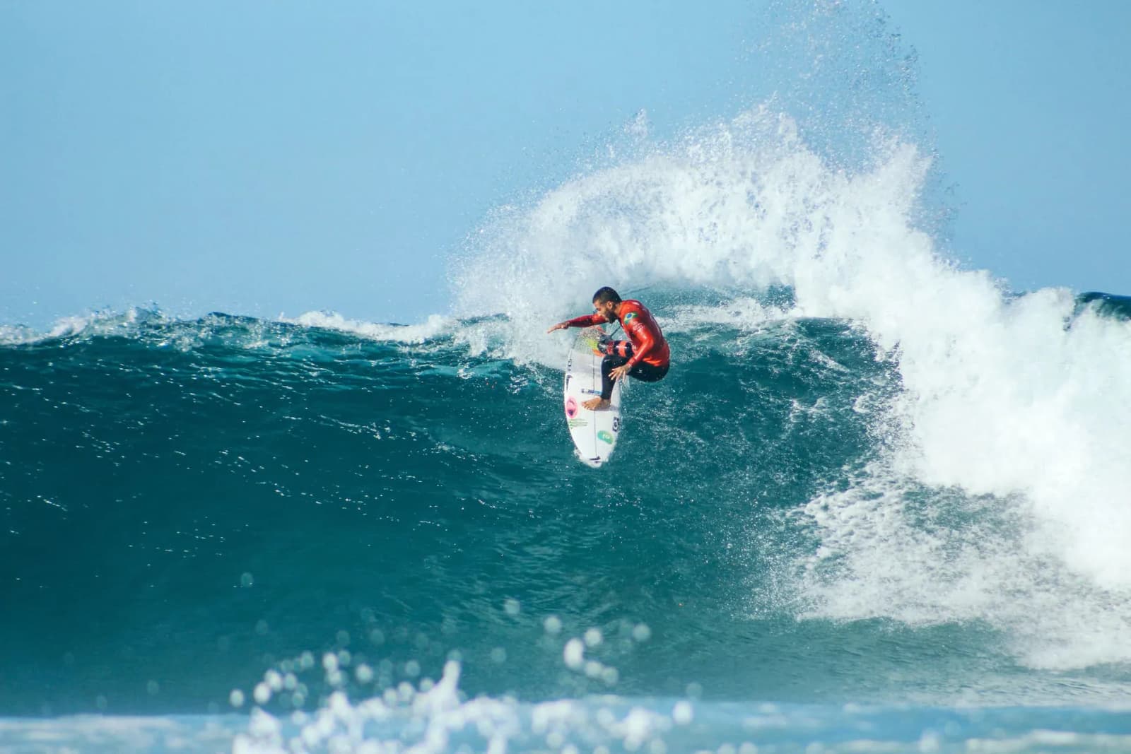Surfer on a long tropical wave at Arugam Bay