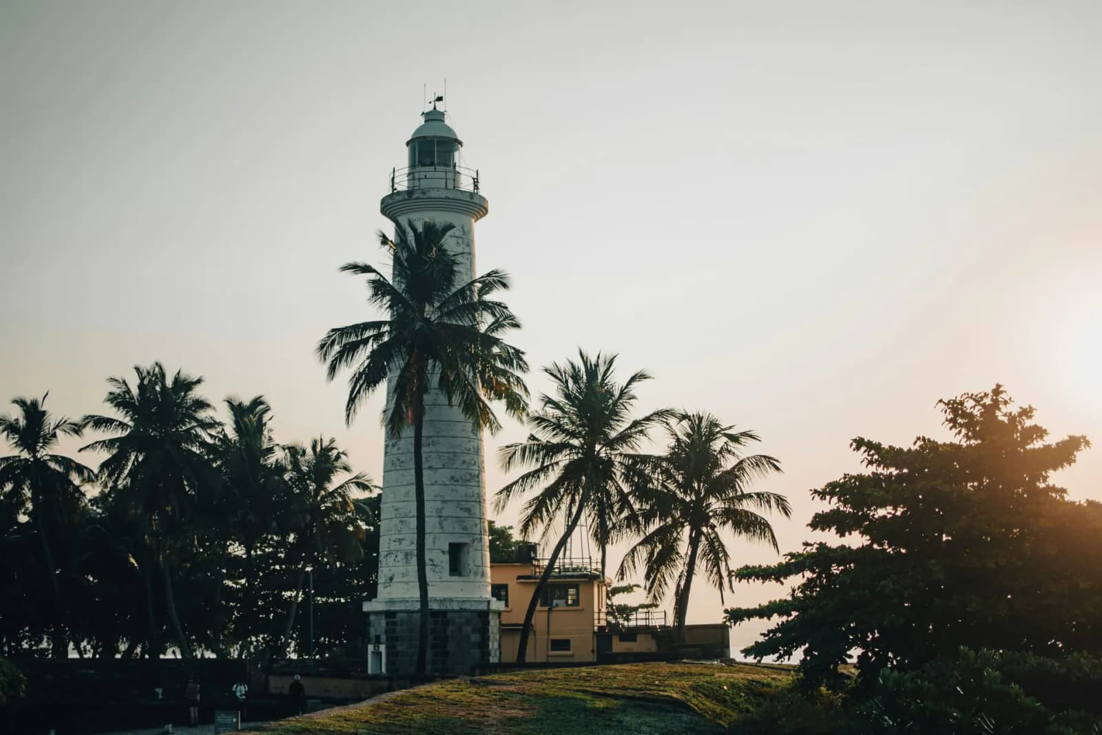 Galle Fort ramparts meeting the ocean at golden hour